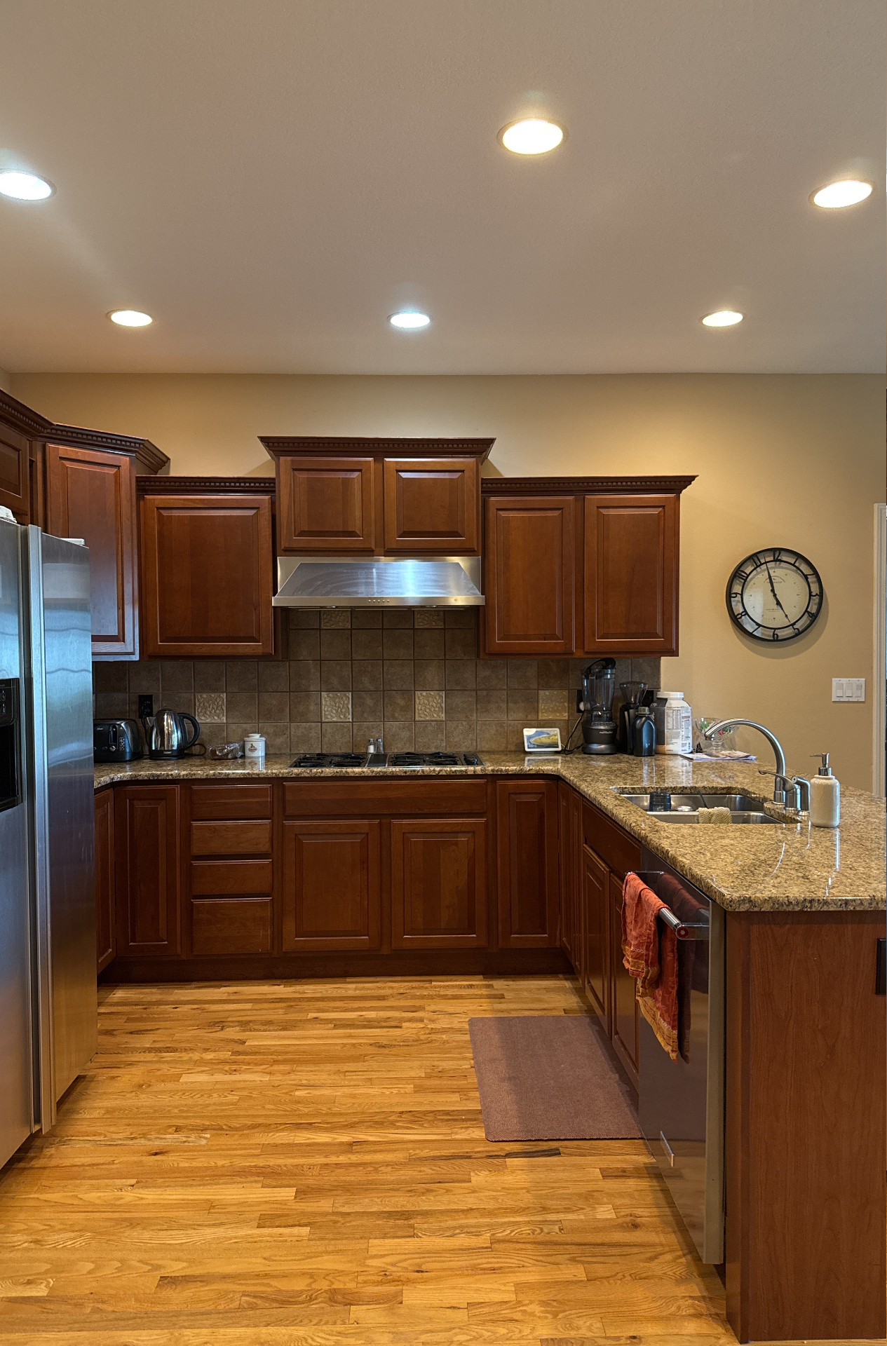 Waterloo kitchen before renovation with darker cabinetry and hardwood flooring