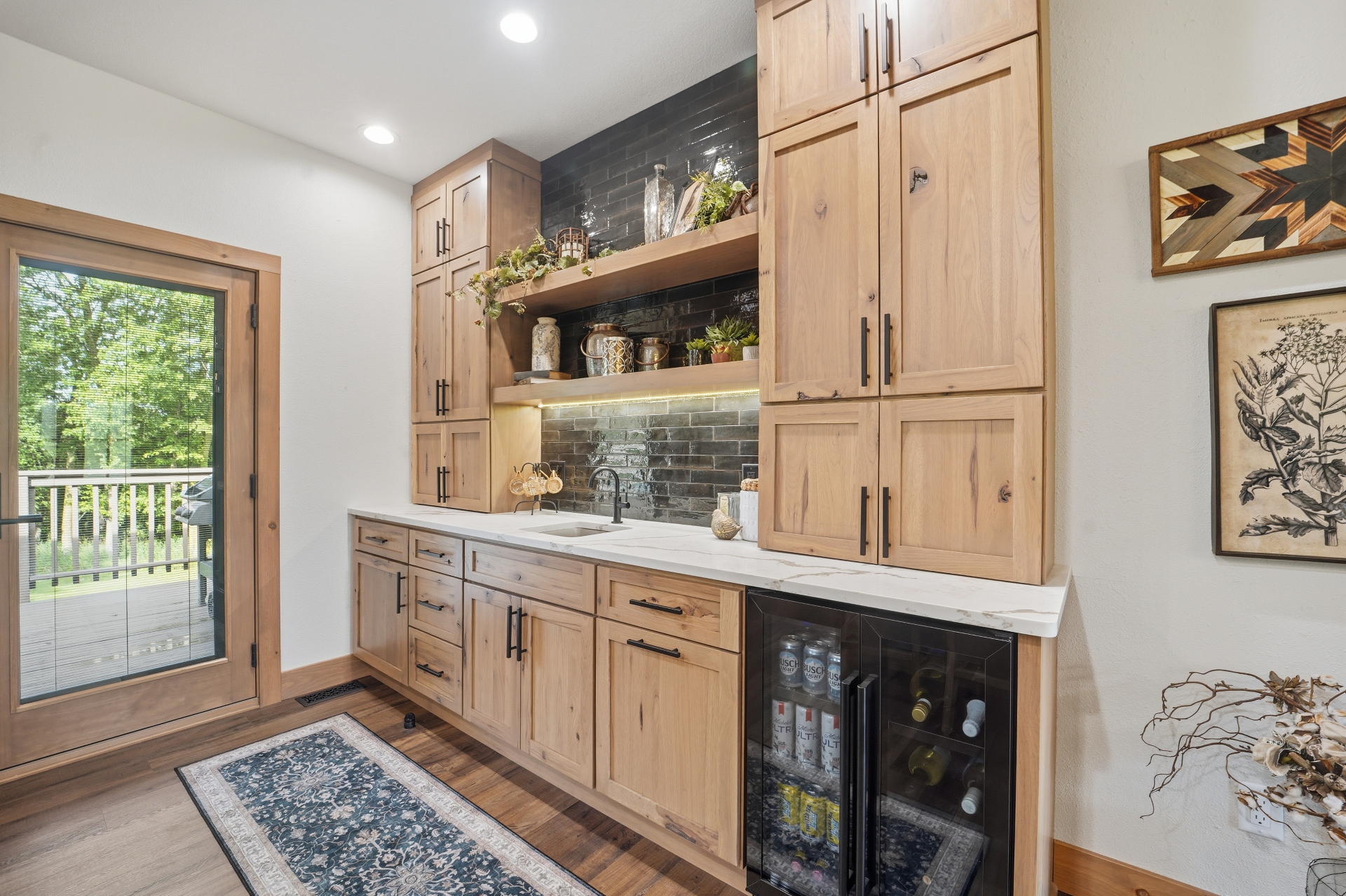 Wet bar with hickory cabinetry, open shelving, quartz counter, and beverage fridge