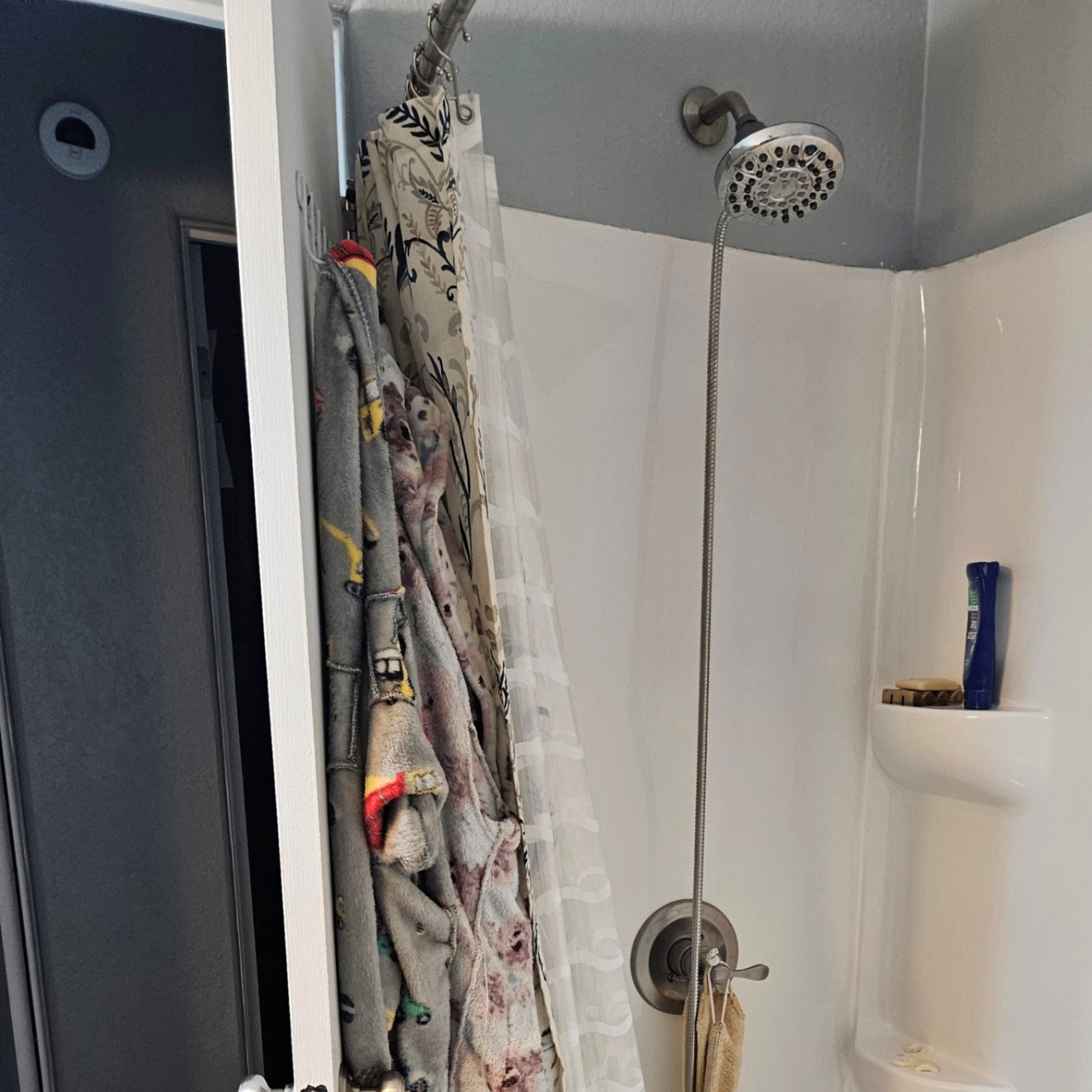 Existing four-piece tub and shower before fast-track replacement