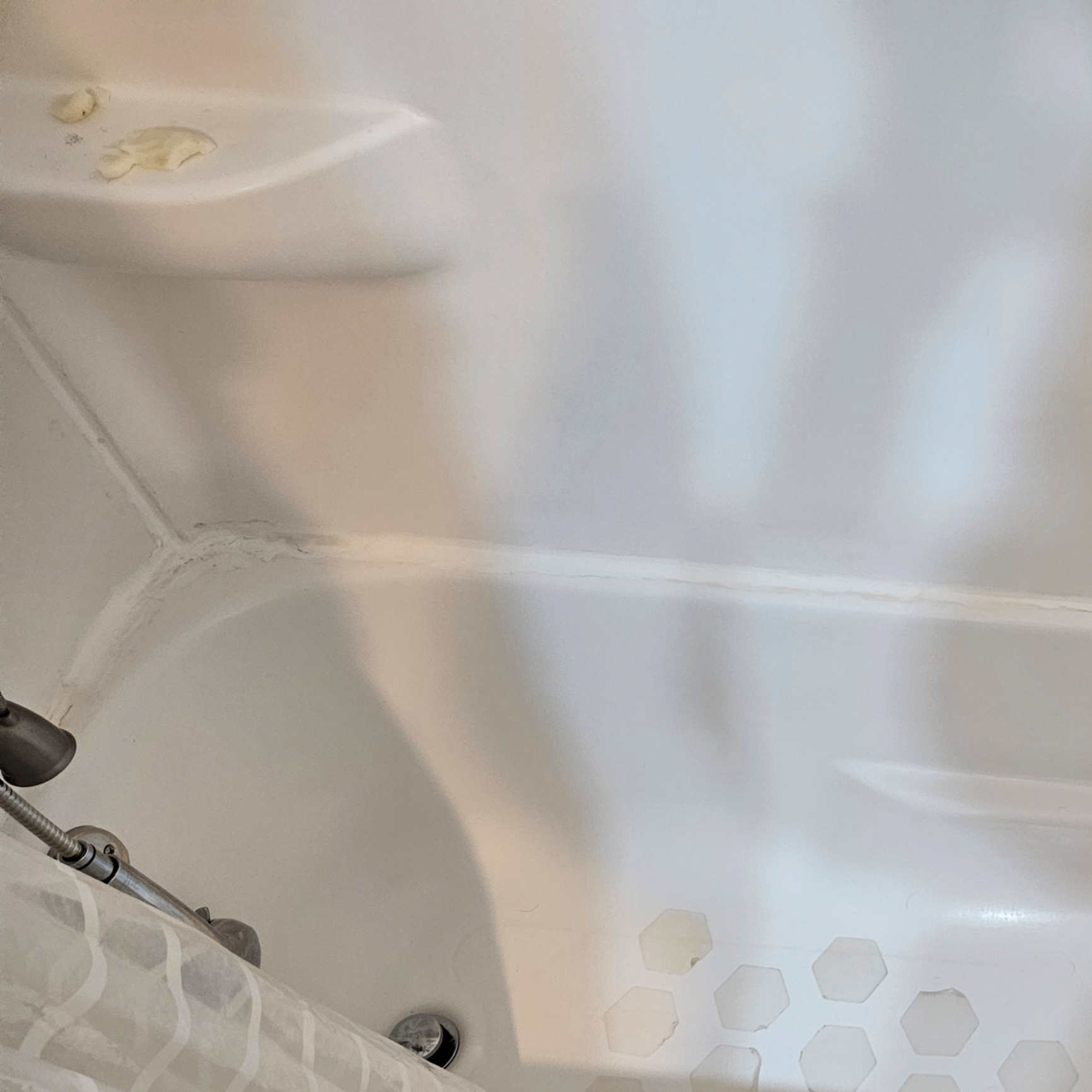 Existing four-piece tub and shower before fast-track replacement