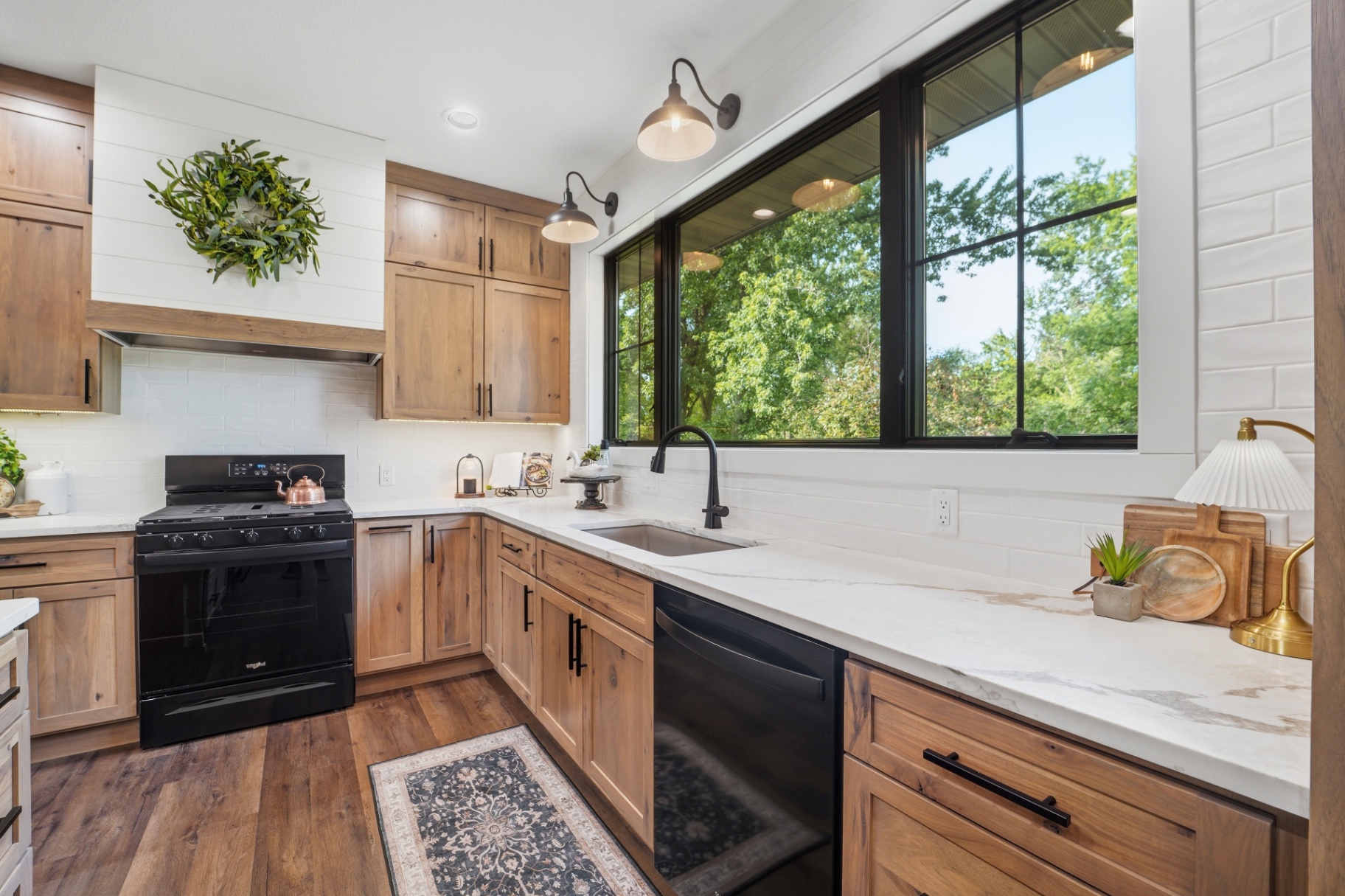 Hickory kitchen range wall with white subway tile backsplash in Gladbrook Iowa