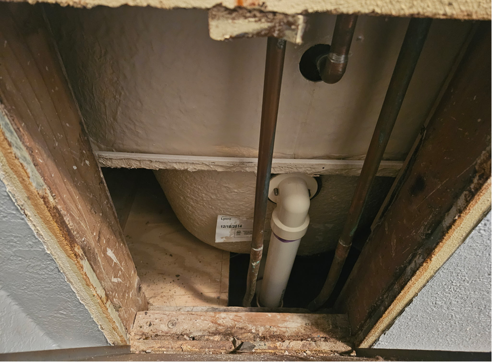 Existing four-piece tub and shower before fast-track replacement