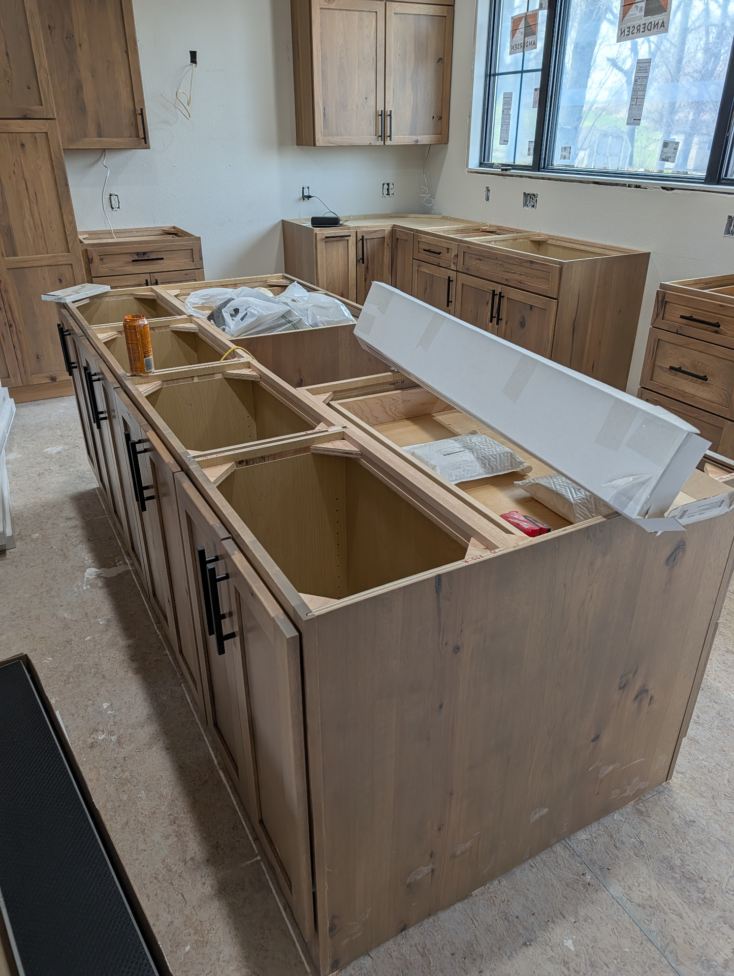 Gladbrook rustic hickory island with two-sided seating design and deep back-side cabinetry
