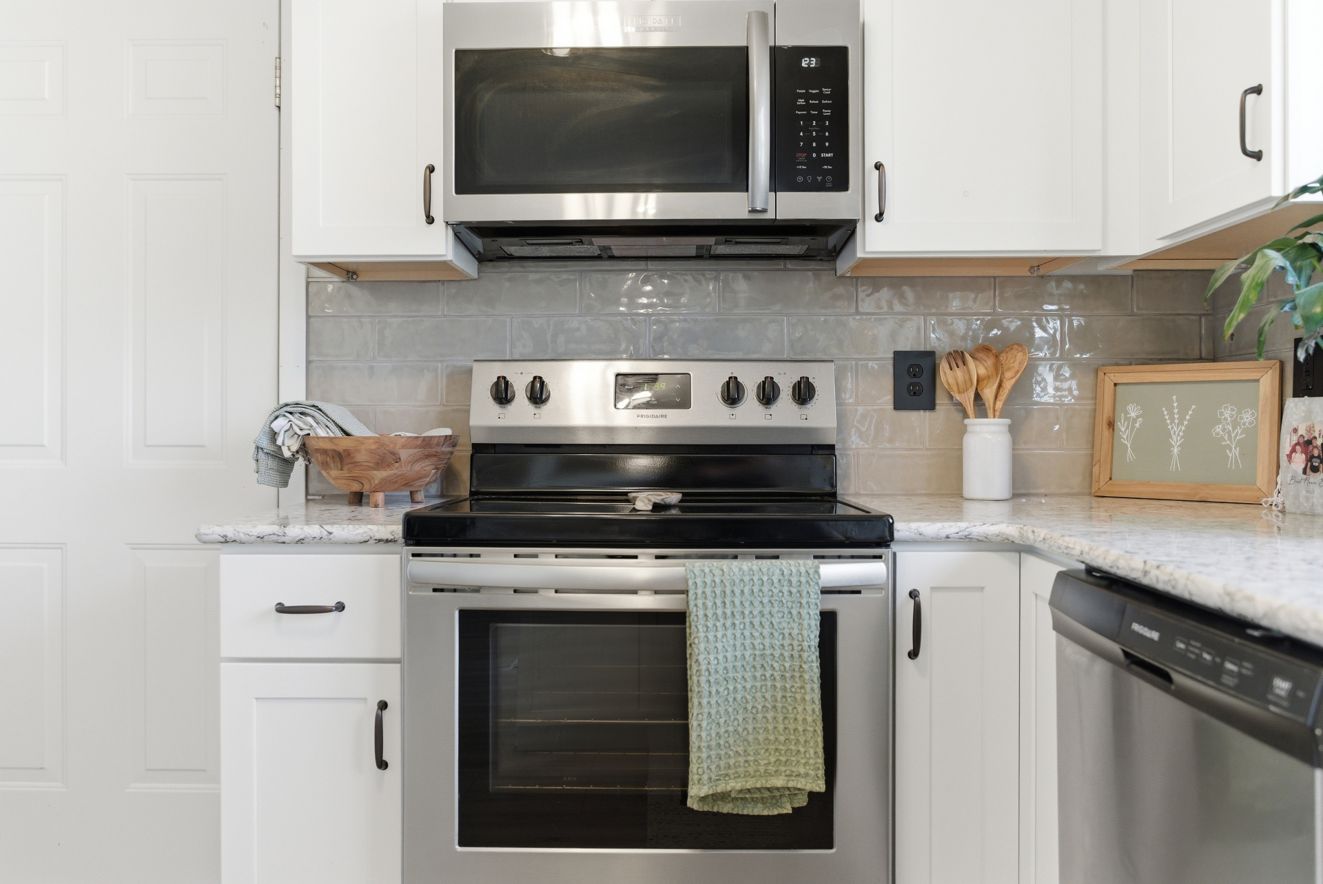 New tile backsplash and stainless steel appliances in a Cedar Falls kitchen refresh