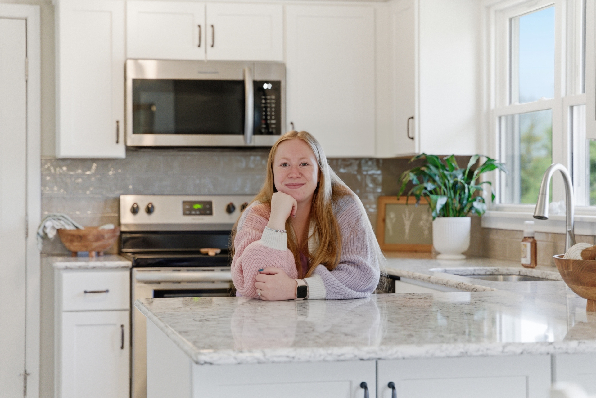 Cedar Falls homeowner in her newly refreshed kitchen