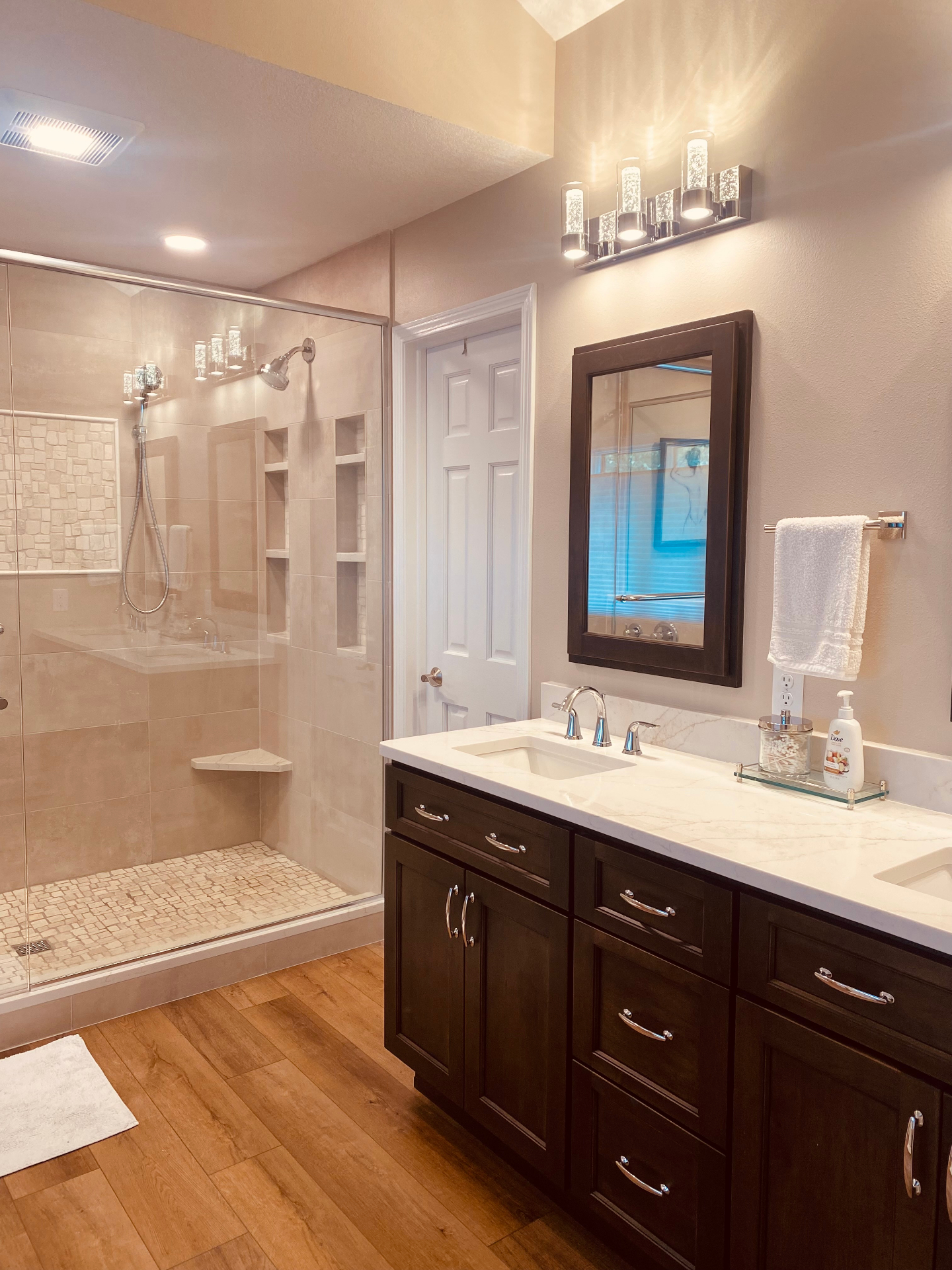 Complete master bath renovation with a dark vanity in Waterloo Iowa