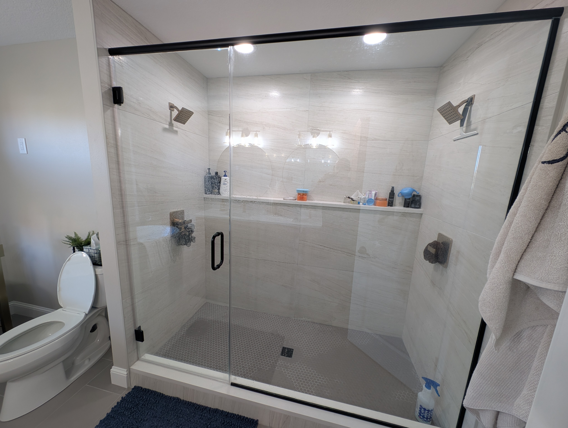 Custom walk-in tile shower with a bench in an Iowa home