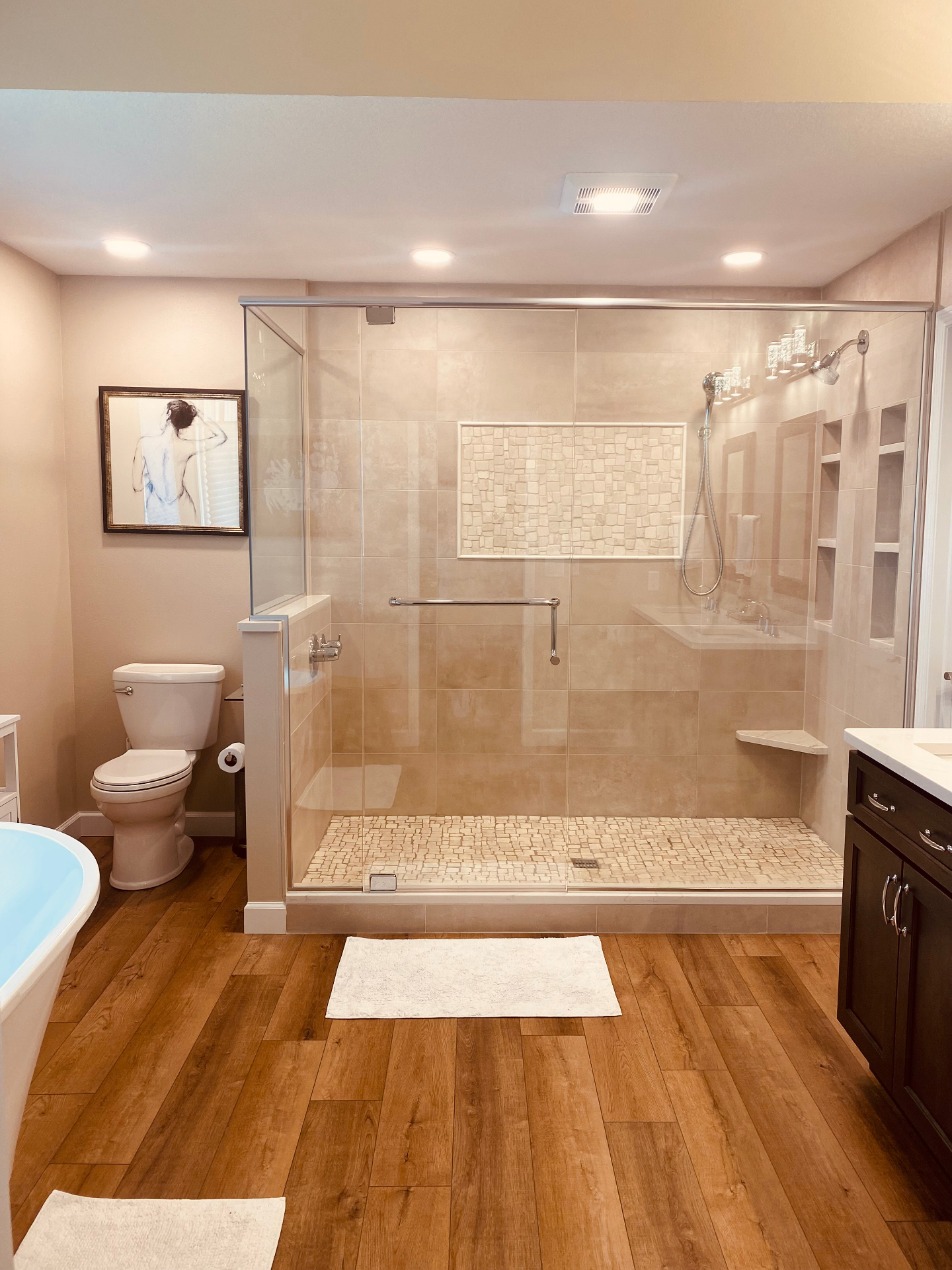 Full master bathroom suite with tub, shower, and vanity remodeled in Iowa