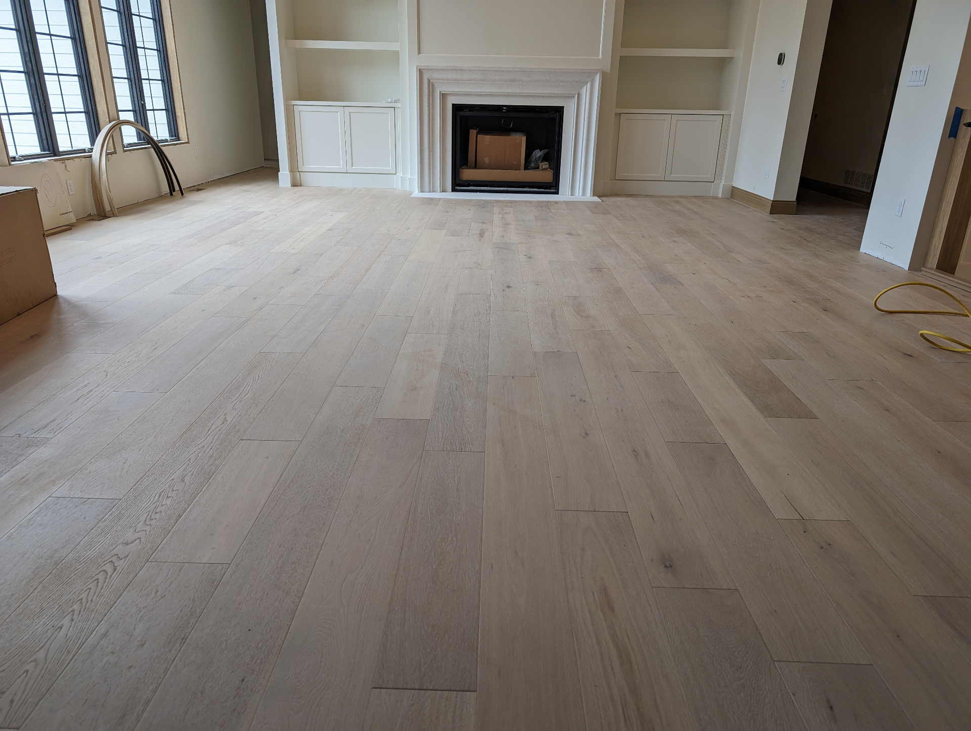 Living Room Hardwood with Fireplace - Flooring project in Cedar Valley, IA