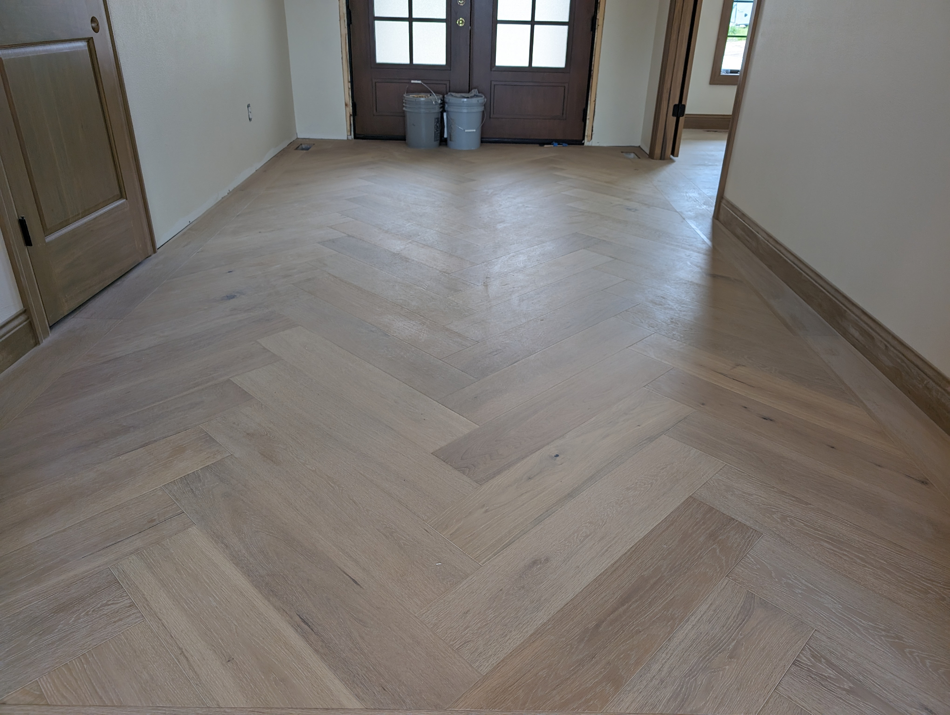 Herringbone wood floor at a Waterloo Iowa home entrance